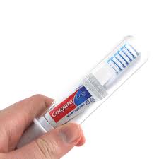 A toothbrush includes a short arm (5) having bristles (1) on one end and the opposite end connected to a receptacle (8) containing toothpaste. Travel Toothbrush Kit Travel Toothbrush Brushing Teeth Colgate Toothpaste