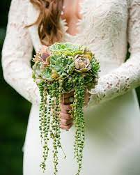 A pomander bouquet does not have to be reserved only for the flower girl. The 7 Best Succulents For Wedding Arrangements