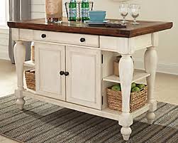 Crafted of solid acacia mangium wood, the sideboard buffet provides enough storage for dishes, silverware, and glassware. Dining Room Storage Buffets Servers Ashley Furniture Homestore