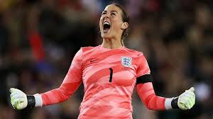 Female football player in red jersey