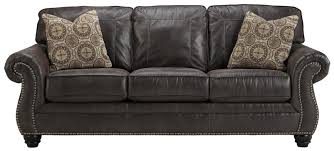 Nfm cannot provide service or exchange as a result of manufacturer's imperfections. Benchcraft Breville Faux Leather Sofa With Rolled Arms And Nailhead Trim Turk Furniture Sofas