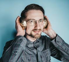 Trying out a left-handed bass guitar at Guitar Center in Cerritos, CA