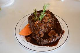 In a large skillet, brown steaks on both sides in oil. Grilled Ribeye Steak With Cabernet Mushrooms Taste Of Arkansas