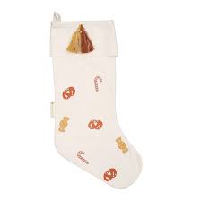 Knowing they wouldn't accept charity, he waited until night to sneak into their house and leave gold coins in the socks he found hanging to dry on the mantle. Fabelab Christmas Stocking Candy Embroided Littlewhimsy