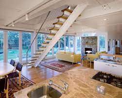 Spiral staircase with a steel handrail. Stairs In Middle Of Room Interior Design