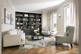 The walls are a medium shade of brown, and the trim is a creamy beige. Blue And Brown Living Room Ideas Photos Houzz