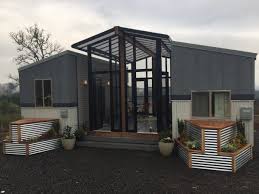 Two 24 Tiny Houses Connected By Sunroom Tiny House Builders Building A Container Home Container House