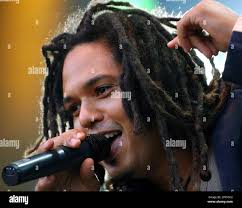 Frank (last name not available), singer of German group Seeed, performs  during a concert at the Open Air in Gampel, Switzerland, Friday, Aug. 15,  2003. (AP Photo/KEYSTONE/Olivier Maire Stock Photo