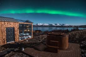 catch unobstructed views of the aurora borealis in this icelandic glass hotel glass cabin northern lights viewing see the northern lights northern lights viewing