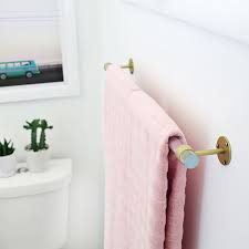 Small bathroom storage idea #1: Lucite Towel Bar Diy A Beautiful Mess