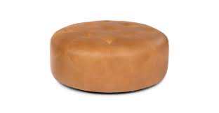 Any interior designer would confirm that a coffee table is a design element that can make a living room feel more welcoming in an instant. Charme Tan Timpani Leather Ottoman Article