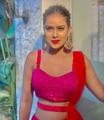 Nia sharma is as bold and fun as her style. Nia Sharma Shines Bright In Red And Pink Ethnic Wear Don T Miss Those Looks Iwmbuzz