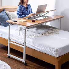 It has casters, but no need to. Usd 188 96 Movable Lifting Cross Bed Table Student Bed Desk Simple Home Computer Lazy Table Bedroom Bedside Writing Table Wholesale From China Online Shopping Buy Asian Products Online From The Best