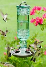 Consult our faq below to ensure your feeder does no harm—and helps your hummers thrive. Hummingbird Feeder Green Glass Bottle Style Adorable Flower Etsy In 2021 Humming Bird Feeders How To Attract Hummingbirds Hummingbird