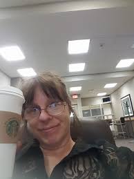 In the cafeteria chugging the coffee waiting