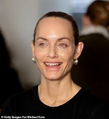 Blake Lively goes wild in giraffe print for Michael Kors' NYFW show as  Katie Holmes flashes her bra in a lace top and Brie Larson oozes elegance