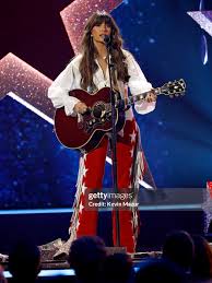 Ella Langley performing at the CMA Awards❤️ @ellalangleymusic This look was  so fun to make! We had @dixonandjack rhinestone the custom chaps  @westerlyusa made! @sheamichellebuckles made custom “Choosin' Texas” belt  buckles to