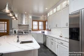 White kitchen cabinets with grey tile floor. White And Grey Modern Kitchen Remodel C T Gabbert Remodeling And Construction