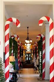 This is a fun dollar tree christmas craft you can make for just a few dollars and makes a fun giant candy decoration. Oversized Candy Cane Prop Google Search Christmas Candy Cane Decorations Christmas Decorations Office Christmas Decorations