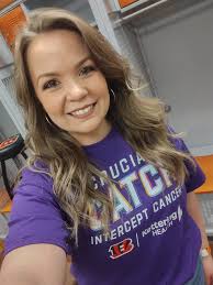 Jami Holbrook stands