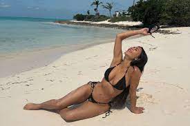 Kim Kardashian Poses on the Beach in Black String Bikini: Photos