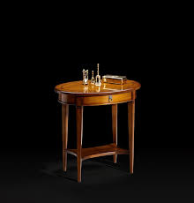 With a classic design of clean lines, this piece is perfect for traditional aesthetics. Prestige Capricci Oval Cherry Wood Coffee Table With Integrated Magazine Rack