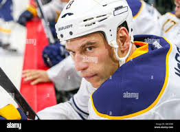 Buffalo Sabres center Cody McCormick (8) gives Pittsburgh Penguins  defenseman Robert Bortuzzo (41) a push during the third period of the Pens  4-1 win at the Consol Energy Center in Pittsburgh on