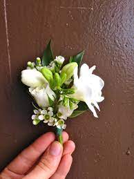 Pin On Corsage Made With White Freesia Spray Roses Waxflower And Ruscus Flower Bouquet Wedding Spray Roses White Wedding Flowers