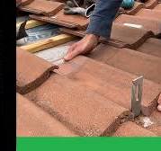 Fitting solar panel brackets to a concrete tile roof