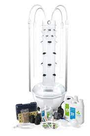 You add kitchen scraps into the center tower which creates a compost tea that drips out the bottom which you add back into the plants. Tower Garden Home Indoor Gardening Tower Garden
