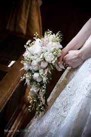 Lindsay bly, a bridal consultant with todich floral design these bouquets sort of disappeared after wwii. Delicate Shower Bouquet Of Peonies Lily Of The Valley And Astilbe Cascading Wedding Bouquets Lily Of The Valley Bouquet Wedding Bridal Bouquets