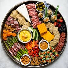 A large plate used for serving food or a meal with one type of food served on a large plate: How To Make A Grazing Platter Healthy Nibbles