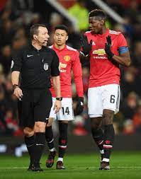 Referee Kevin Friend And Paul Pogba Of Manchester United In Discussion During The Emirates Fa Manchester United Manchester United Fans Premier League Football
