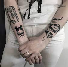 Girls can also add a sugar candy skull tattoo design to their owl tattoo to give it more feminine look. Various Black Tattoos On Both Forearms Minimal Tattoo Tattoos Black Tattoos