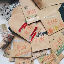 Finishing A Homemade Advent Calendar For My Boyfriend I Snacked On So Many Of The Treats Before Homemade Advent Calendars Diy Advent Calendar Christmas Stamps