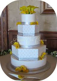 Elegant White And Silver Wedding Cake With Yellow Calla Lilies Silver Wedding Cake Cool Wedding Cakes Gray Wedding Cake
