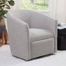 A fabric swivel glider is an upholstered chair that combines two separate motions to provide extraordinary freedom of movement and comfort to the pair a couple of fabric swivel gliders with a coffee table and a great sofa or sectional for a great entertainment area in your living room. Comfort Pointe Lynton Sea Oat Beige Fabric Swivel Chair 2003 09