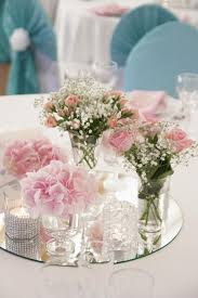 Floroom artificial flowers 25pcs real looking blush foam fake roses with stems for diy wedding bouquets bridal shower centerpieces party decorations 4.8 out of 5 stars 7,212 $12.99 $ 12. Pink Flowers In Small Glass Vases Stand On The Mirror On The Wedding Day Stock Image Image Of Bush Close 140467997