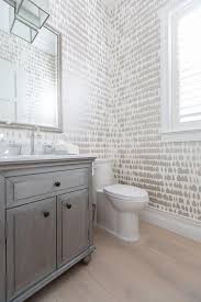 Traditional powder rooms are practical spaces that have a timeless, comfortable feel. Dark Powder Room Wood Floors Design Ideas