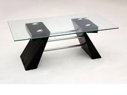 Looking for a glass coffee table? Clear Glass Coffee Table With Black Shaped Wooden Base Homegenies