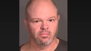 Charges: 'Trump supporter' swings golf club at couple with political sign