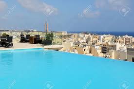 To make a fiberglass swimming pool shell from a mold, we start by spraying the outside of the mold with the gelcoat layer. The Swimming Pool On The Top Of Building Of Hotel Malta Stock Photo Picture And Royalty Free Image Image 93283579