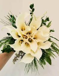 Once secured, using a wide satin ribbon that matches one of your wedding colors, wrap the stems to cover the tape, and finish it off with a simple. Winter Calla Lily Bouquet Calla Lily Bouquet Wedding Calla Lily Bouquet Calla Lily