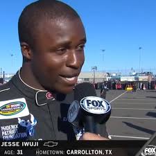 NASCAR Truck Series driver and Navy Lieutenant Jesse Iwuji talks with  Hermie Sadler
