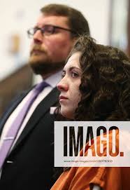 Syndication: Akron Beacon Journal Jillian Ibel and her defense attorney Wes  Buchanan listen to Ibel