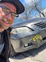 My flowers reflected in my car bumper, I thought it was kind of neat!