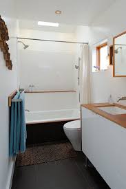 Bathroom flooring can make a big statement, whether it's a large master bathroom or a small powder room. Small Bathroom Decorated In White Wall And Black Floor Tile Along With Bright Ceiling Light And Small Wind Small Bathroom Window Modern Bathroom Small Bathroom