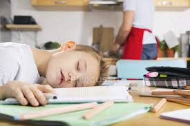 If your repertoire is just pasta and frozen meals, then this bootcamp is for you. Boy At Kitchen Table Sleeping On His School Book Father Cooking On Background Child Exercise Book Stock Photo 180106172