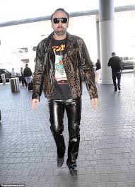 Nicolas kim coppola (born january 7, 1964), known professionally as nicolas cage, is an american actor and filmmaker. Nicolas Cage Dons Luxe Leather Look In Animal Print Jacket And Skintight Pants Through Lax Airport Daily Mail Online