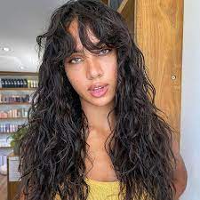 Adding bangs to your haircut must be one of the best hairstyle changes you had in years because they will give such proper framing and draw all the attention on your eyes. Curtain Bangs With Curly Hair